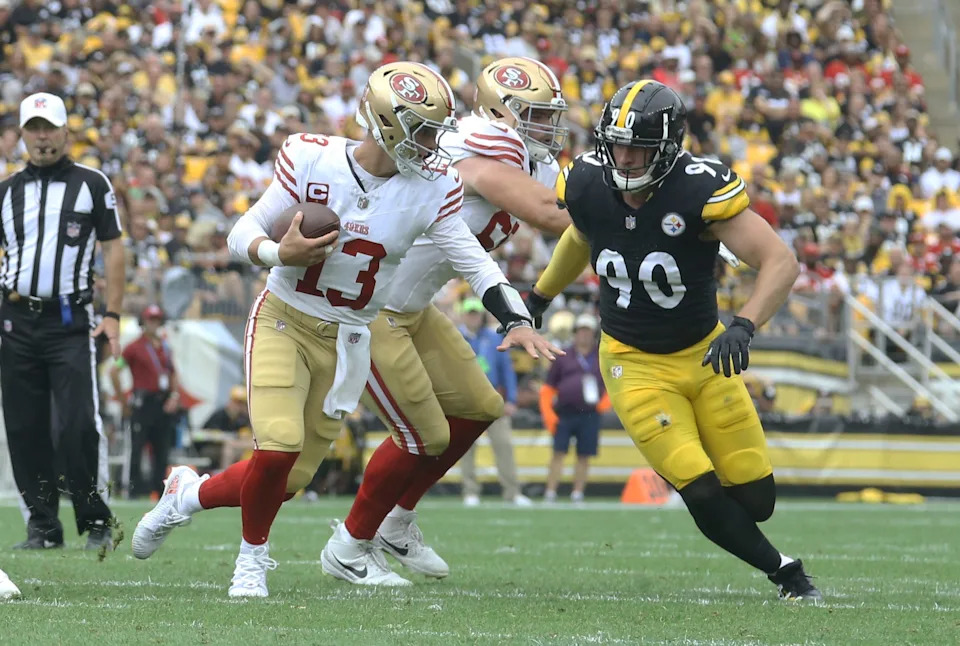 Sep 10, 2023; Pittsburgh, Pennsylvania, USA; San Francisco 49ers quarterback Brock Purdy (13) scrambles with the ball as Pittsburgh Steelers linebacker T.J. Watt (90) chases during the second quarter at Acrisure Stadium. Mandatory Credit: Charles LeClaire-USA TODAY Sports