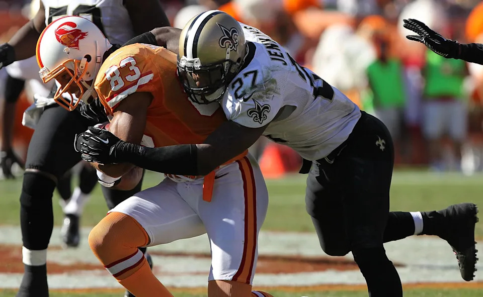October 21, 2012; Tampa, FL, USA; New Orleans Saints free safety Malcolm Jenkins (27) tackles Tampa Bay Buccaneers wide receiver Vincent Jackson (83) during the second half at Raymond James Stadium. New Orleans Saints defeated the Tampa Bay Buccaneers 35-28. Mandatory Credit: Kim Klement-USA TODAY Sports