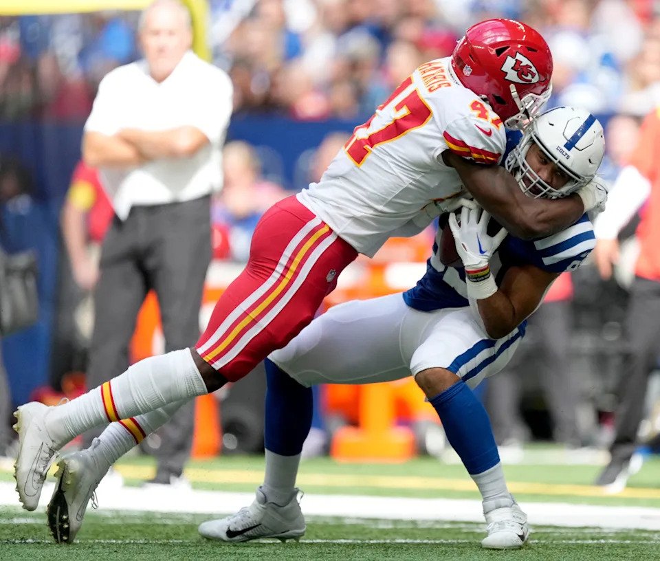 Sep 25, 2022; Indianapolis, Indiana, USA; Kansas City Chiefs linebacker Darius Harris (47) tackles Indianapolis Colts tight end Kylen Granson (83) during a game against the Kansas City Chiefs at Lucas Oil Stadium. Mandatory Credit: Robert Scheer/IndyStar Staff-USA TODAY Sports