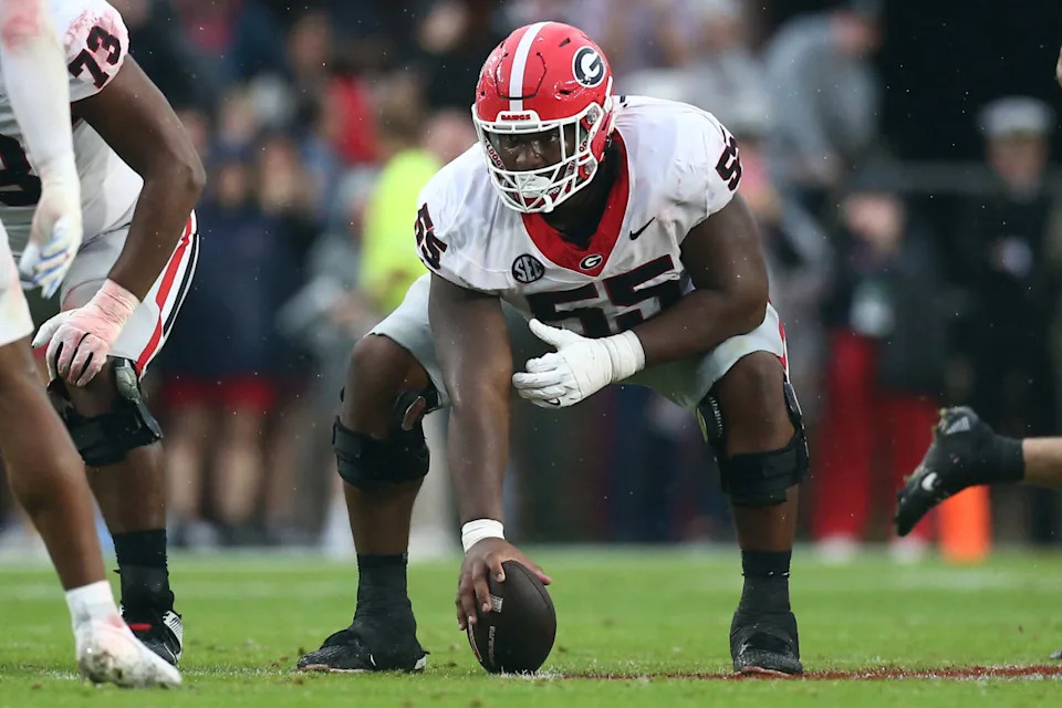 Georgia Bulldogs offensive lineman Jared Wilson (55) prepares to snap the ball during the first half against the Mississippi Rebels at Vaught-Hemingway Stadium.Petre Thomas-Imagn Images