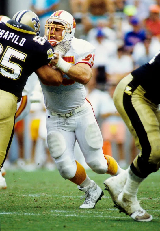 Sep 24, 1989; FILE PHOTO; Tampa Bay Buccaneers nose tackle Curt Jarvis (95) in action against New Orleans Saints offensive guard Steve Trapilo (65). Mandatory Credit: RVR Photots-Imagn Images