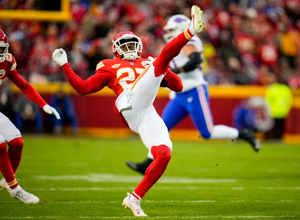 Dec 10, 2023; Kansas City, Missouri, USA; Kansas City Chiefs safety Chamarri Conner (27) intercepts a pass during the first half against the Buffalo Bills at GEHA Field at Arrowhead Stadium. Mandatory Credit: Jay Biggerstaff-USA TODAY Sports
