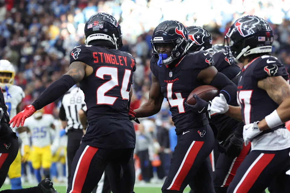 Houston Texans corner back Kamari Lassiter (4) celebrates an interceptionTroy Taormina-Imagn Images