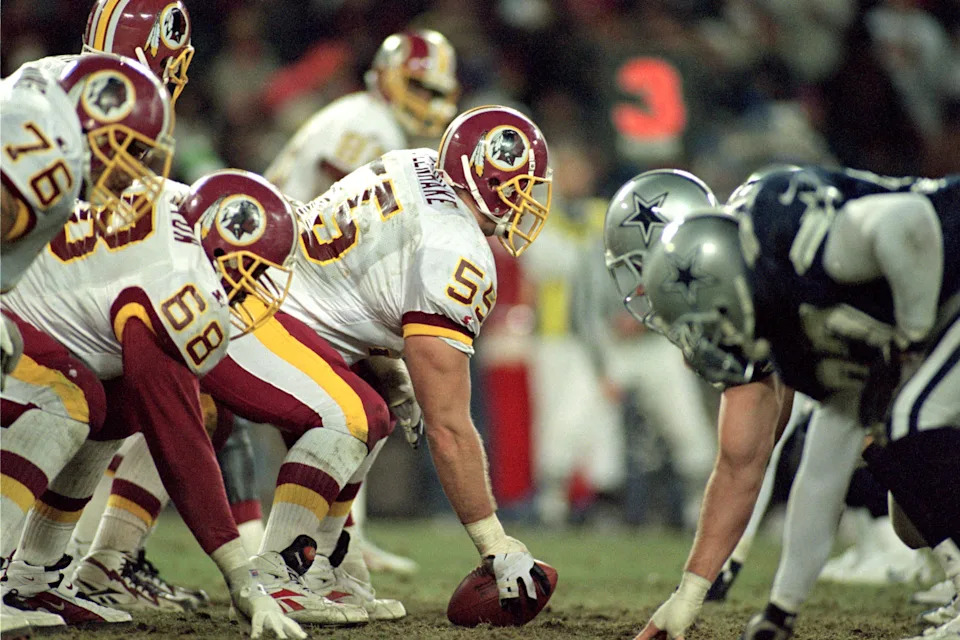 WASHINGTON - DECEMBER 22: Center Jeff Uhlenhake #55 of the Washington Redskins prepares to snap the ball against the Dallas Cowboys during the NFL game at RFK Stadium on December 22, 1996 in Washington, D.C. The Redskins defeated the Cowboys 37-7. (Photo by Doug Pensinger/Getty Images)