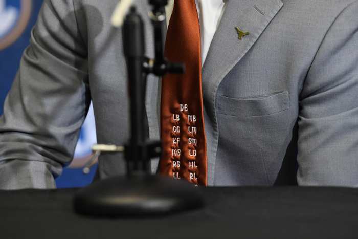 Texas football players wear tie with initials of Camp Mystic flood victims at SEC Media Days