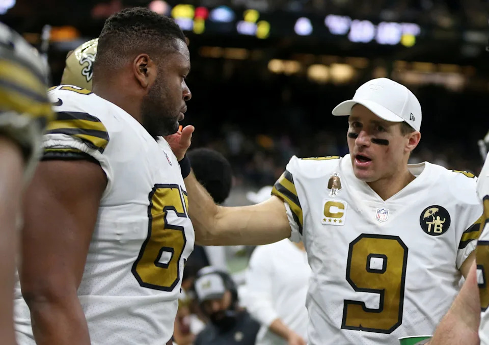 Nov 18, 2018; New Orleans, LA, USA; New Orleans Saints quarterback Drew Brees (9) talks to center Cameron Tom (63) in the second half against the Philadelphia Eagles at the Mercedes-Benz Superdome. The Saints won, 48-7. Mandatory Credit: Chuck Cook-USA TODAY Sports