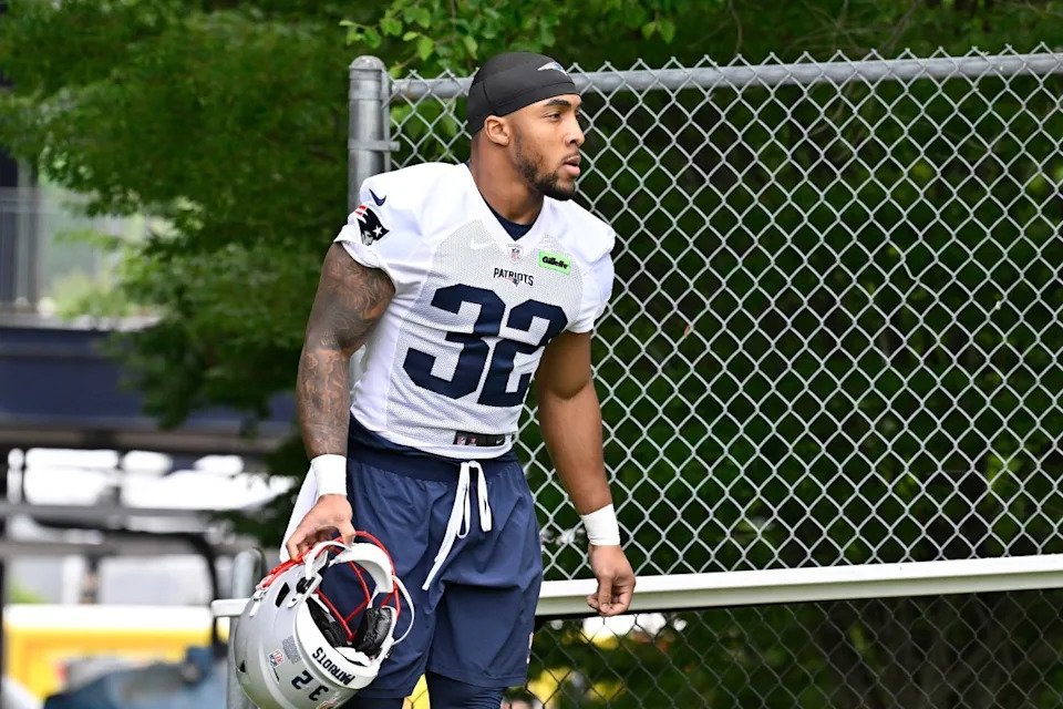 New England Patriots running back TreVeyon Henderson (32) walks to the practice fields at Gillette Stadium.Eric Canha-Imagn Images