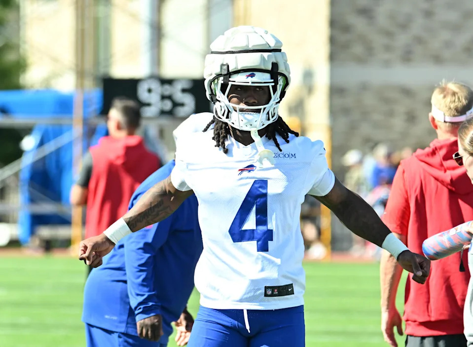 Jul 23, 2025; Rochester, NY, USA; Buffalo Bills running back James Cook (4) warms up during training camp at St. John Fisher University. Mandatory Credit: Mark Konezny-Imagn Images