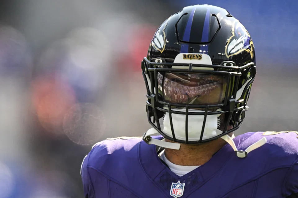 Oct 13, 2024; Baltimore, Maryland, USA; Spectzatord reflect off Baltimore Ravens linebacker Kyle Van Noy (53) mask before the game against the Washington Commanders at M&T Bank Stadium. Mandatory Credit: Tommy Gilligan-Imagn Images