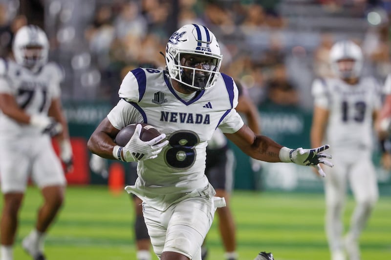 HONOLULU, HAWAII - OCTOBER 26: Cortez Braham Jr. #8 of the Nevada Wolfpack runs the ball during the second half of the game against the Hawaii Rainbow Warriors at the Clarence T.C. Ching Athletics Complex on October 26, 2024 in Honolulu, Hawaii.  (Photo by Darryl Oumi/Getty Images)
