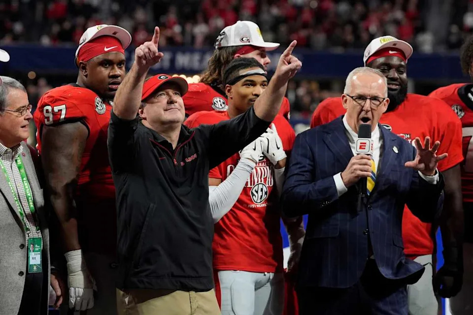 Georgia coach Kirby Smart celebrates with his team after winning the SEC championship game against Texas.Joshua L&period; Jones &sol; USA TODAY NETWORK via Imagn Images