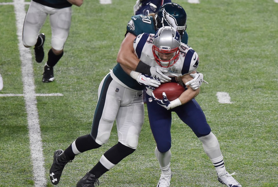 Philadelphia Eagles' Bryan Braman tackling New England Patriots' Rex Burkhead during Super Bowl LII.