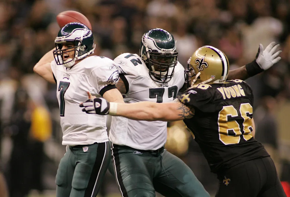 Jan. 13, 2007; New Orleans Saints defensive tackle Brian Young pressures Philadelphia Eagles quarterback Jeff Garcia (7) during the NFC Divisional Playoffs. Mandatory Credit: John David Mercer-Imagn Images © 2006 John David Mercer