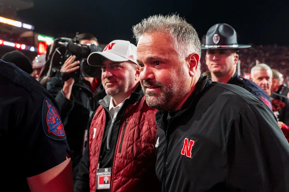 Nov 23, 2024; Lincoln, Nebraska, USA; Nebraska Cornhuskers head coach Matt Rhule and athletic director Troy Dannen walk off the field after defeating the Wisconsin Badgers at Memorial Stadium. Mandatory Credit: Dylan Widger-Imagn Images
