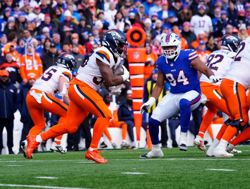 Denver Broncos running back Jaleel McLaughlin (38) runs for a gain during the second quarter in an AFC wild-card game at Highmark Stadium.Gregory Fisher-Imagn Images