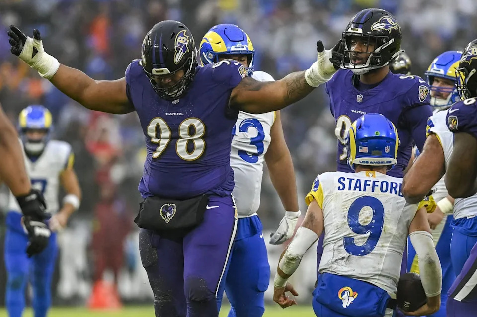 Dec 10, 2023; Baltimore, Maryland, USA; Baltimore Ravens defensive tackle Travis Jones (98) reacts after sacking Los Angeles Rams quarterback Matthew Stafford (9) during the second half at M&T Bank Stadium.