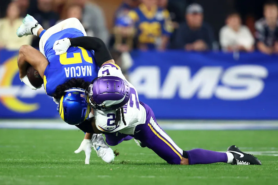 Los Angeles Rams wide receiver Puka Nacua (17) makes a catch against Minnesota Vikings cornerback Stephon Gilmore (2) during the second half in an NFC wild card game at State Farm Stadium.Mark J&period; Rebilas-Imagn Images