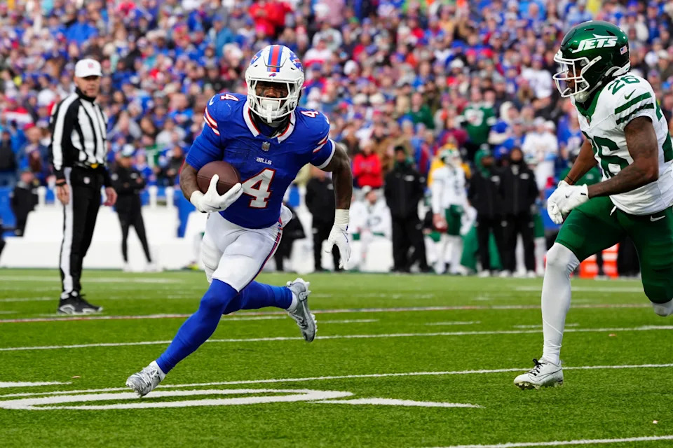 Dec 29, 2024; Orchard Park, New York, USA; Buffalo Bills running back James Cook (4) runs with the ball against the New York Jets during the second half at Highmark Stadium. Mandatory Credit: Gregory Fisher-Imagn Images