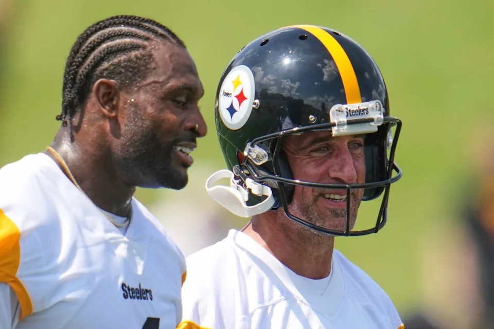 Pittsburgh Steelers quarterback Aaron Rodgers, right, stands with wide receiver DK Metcalf during NFL football team's training camp in Latrobe, Pa., Thursday, July 24, 2025. (AP Photo/Gene J. Puskar)