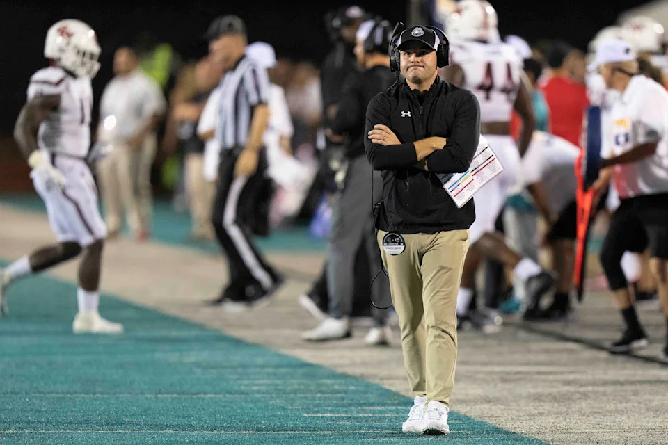 Gardner-Webb Runnin Bulldogs head coach Tre Lamb walks the side lines in a game against the Coastal Carolina Chanticleers at Brooks Stadium.