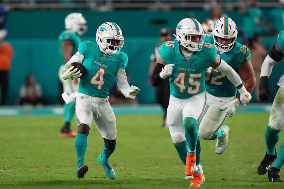 Dec 22, 2024; Miami Gardens, Florida, USA; Miami Dolphins cornerback Kader Kohou (4) runs with the ball after intercepting a pass from San Francisco 49ers quarterback Brock Purdy (13, not pictured) during second half at Hard Rock Stadium. Mandatory Credit: Jasen Vinlove-Imagn Images
