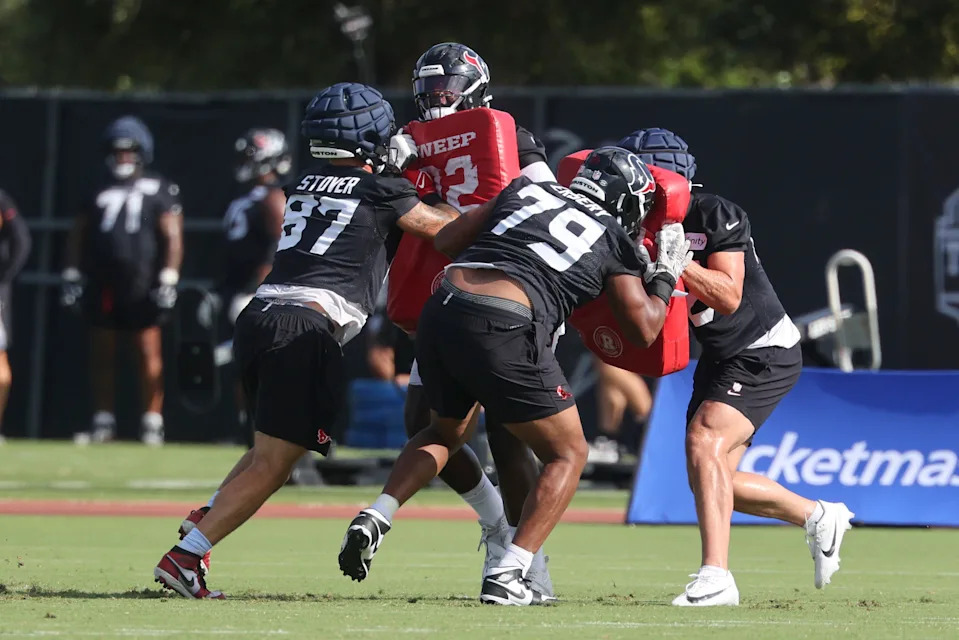 Jul 24, 2025; Houston, TX, USA; Houston Texans tight end Cade Stover (87) and Houston Texans Aireontae Ersery (79) during training camp at Houston Methodist Training Center. Mandatory Credit: Troy Taormina-Imagn Images