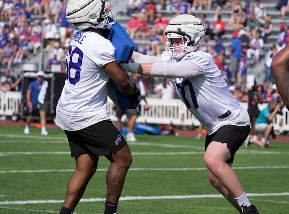 Buffalo Bills offensive tackle Tylan Grable tries to keep offensive tackle Chase Lundt at bay during the Buffalo Bills training camp at St. John Fisher University in Pittsford on July 24, 2025.