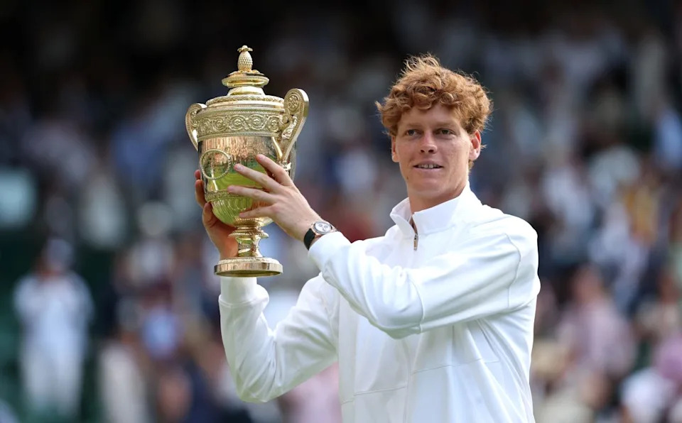 LONDON, ENGLAND - JULY 13: Jannik Sinner of Italy poses with the Gentlemen’s Singles Trophy following his victory against Carlos Alcaraz of Spain during the Gentlemen’s Singles Final on day fourteen of The Championships Wimbledon 2025 at All England Lawn Tennis and Croquet Club on July 13, 2025 in London, England. (Photo by Julian Finney/Getty Images)