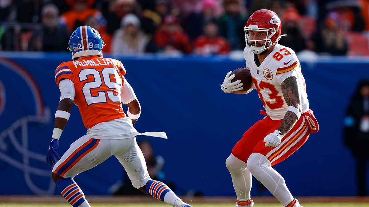 Kansas City Chiefs tight end Noah Gray (83) runs the ball as Denver Broncos cornerback Ja'Quan McMillian (29) defends in the first quarter at Empower Field at Mile High.
