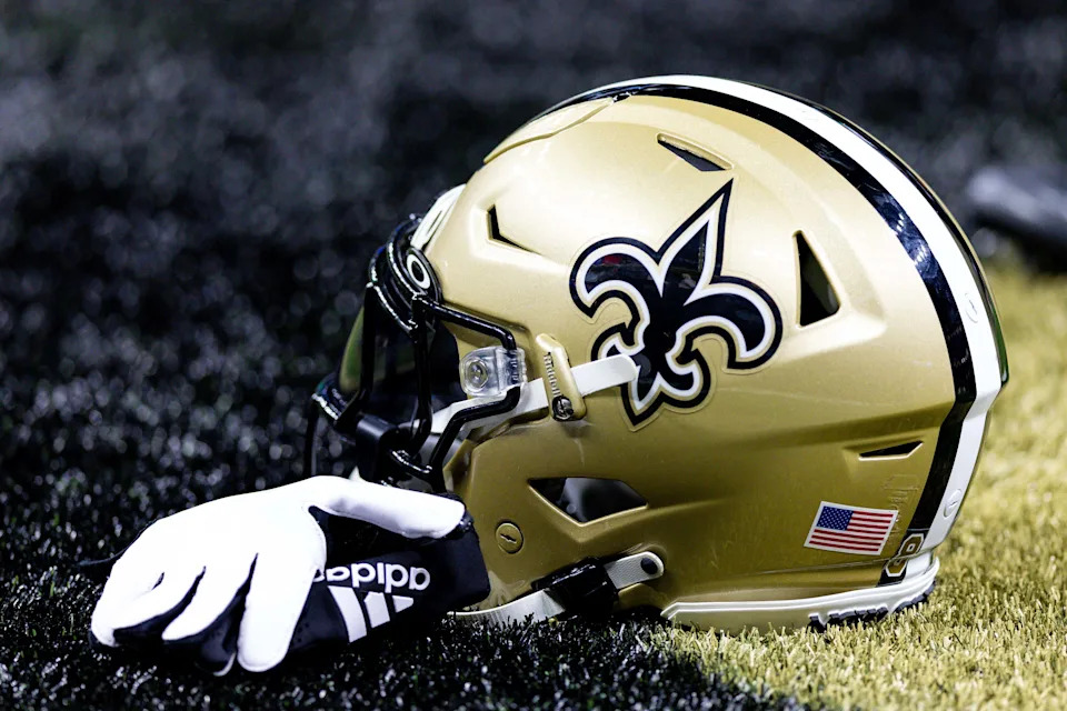 Aug 13, 2023; New Orleans, Louisiana, USA; Detailed view of the New Orleans Saints helmet and glove during pregame against the Kansas City Chiefs at the Caesars Superdome. Mandatory Credit: Stephen Lew-USA TODAY Sports