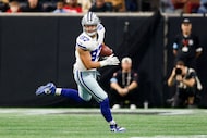 Dallas Cowboys tight end Jake Ferguson (87) turns up field after making a catch during the...