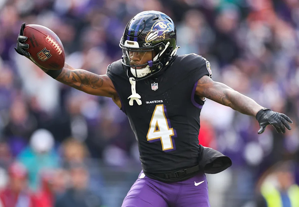 BALTIMORE, MARYLAND - DECEMBER 31: Zay Flowers #4 of the Baltimore Ravens carries the ball for a touchdown against the Miami Dolphins during the second quarter of the game at M&T Bank Stadium on December 31, 2023 in Baltimore, Maryland. (Photo by Rob Carr/Getty Images)
