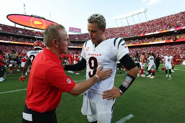 Kansas City Chiefs defensive coordinator Steve Spagnuolo speaks with Cincinnati Bengals quarterback Joe Burrow