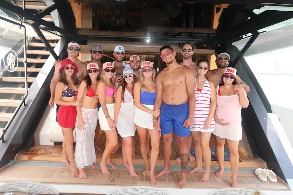 Patrick Mahomes showed off his “dad bod” while posing with his wife, Brittany Mahomes, and their friends on a yacht in Miami. Cassidy Kayy/Instagram