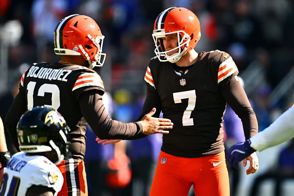 Cleveland Browns holder Corey Bojorquez (13) and kicker Dustin Hopkins (7) celebrate after Hopkins' field goal against the Baltimore Ravens on Oct. 27, 2024, in Cleveland, Ohio.