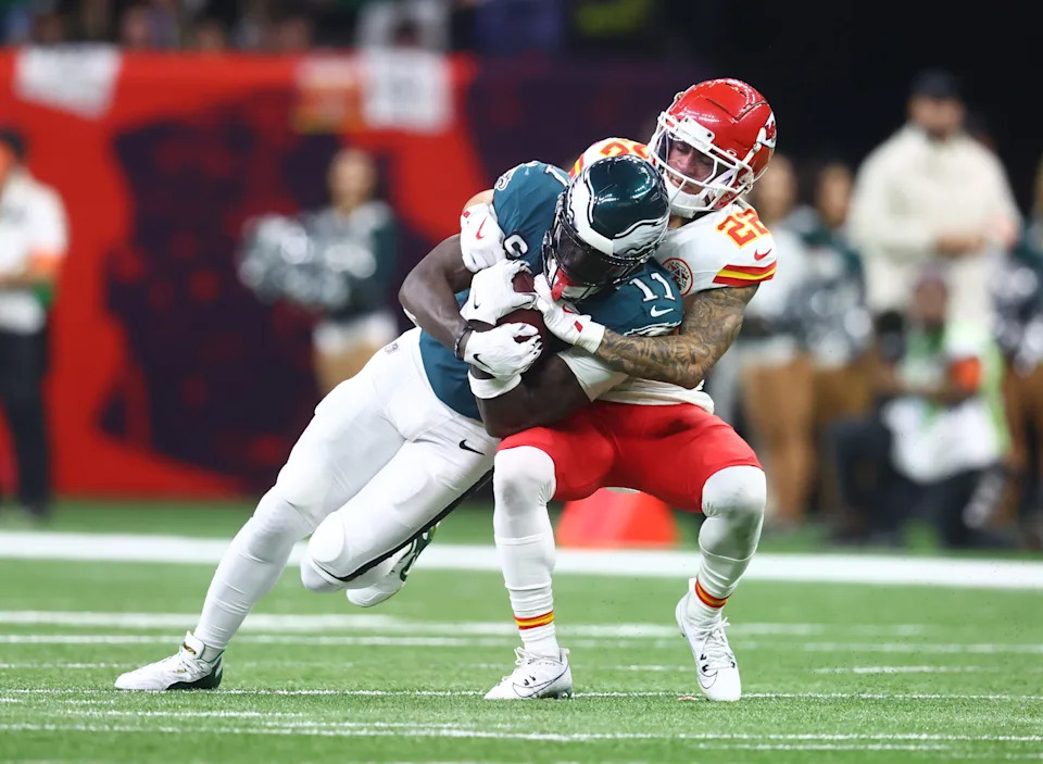 Feb 9, 2025; New Orleans, LA, USA; Philadelphia Eagles wide receiver A.J. Brown (11) is tackled by Kansas City Chiefs cornerback Trent McDuffie (22) in the fourth quarter in Super Bowl LIX at Ceasars Superdome. Mandatory Credit: Mark J. Rebilas-Imagn Images