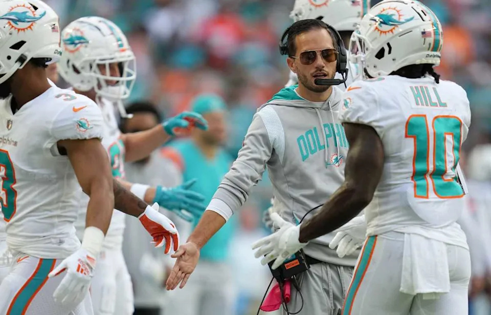 Miami Dolphins head coach Mike McDaniel greets Miami Dolphins wide receiver Tyreek Hill (10) on the sideline during the first half of an NFL game against Houston Texans at Hard Rock Stadium in Miami Gardens, Nov. 27, 2022.JIM RASSOL / THE PALM BEACH POST / USA TODAY NETWORK