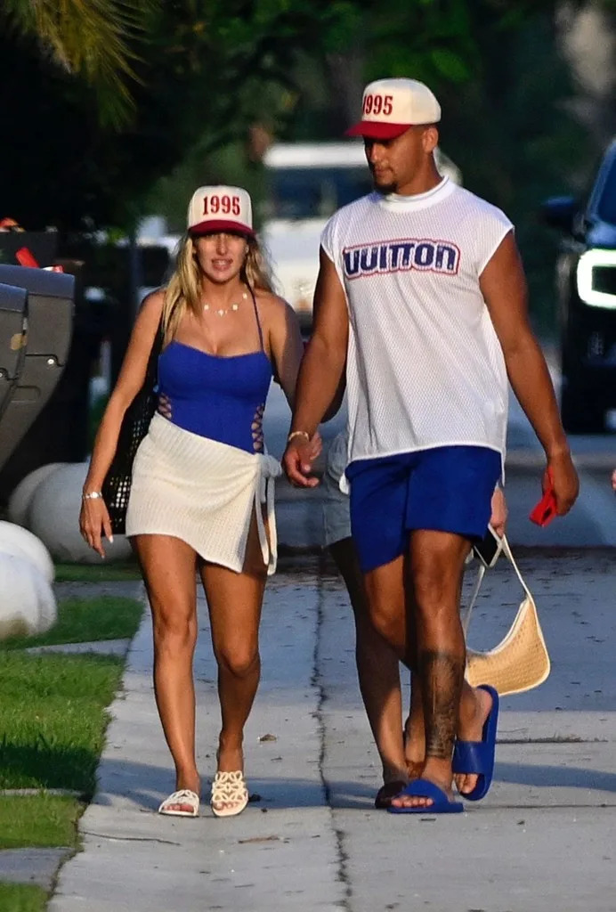 He and Brittany also rocked matching “1995” hats. BACKGRID