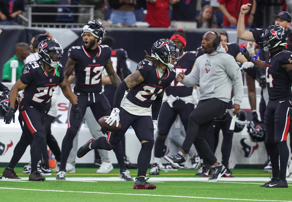 Dec 15, 2024; Houston, Texas, USA; Houston Texans cornerback Derek Stingley Jr. (24) runs with the ball after an interception during the fourth quarter against the Miami Dolphins at NRG Stadium. Mandatory Credit: Troy Taormina-Imagn Images