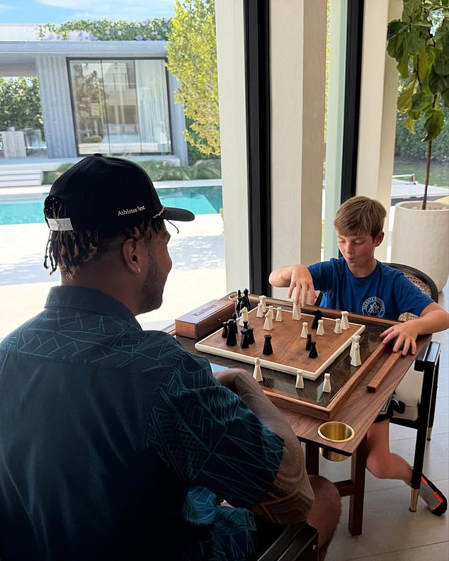 Ivanka shared a snap of the Miami Dolphins quarterback playing chess with the eight-year-old