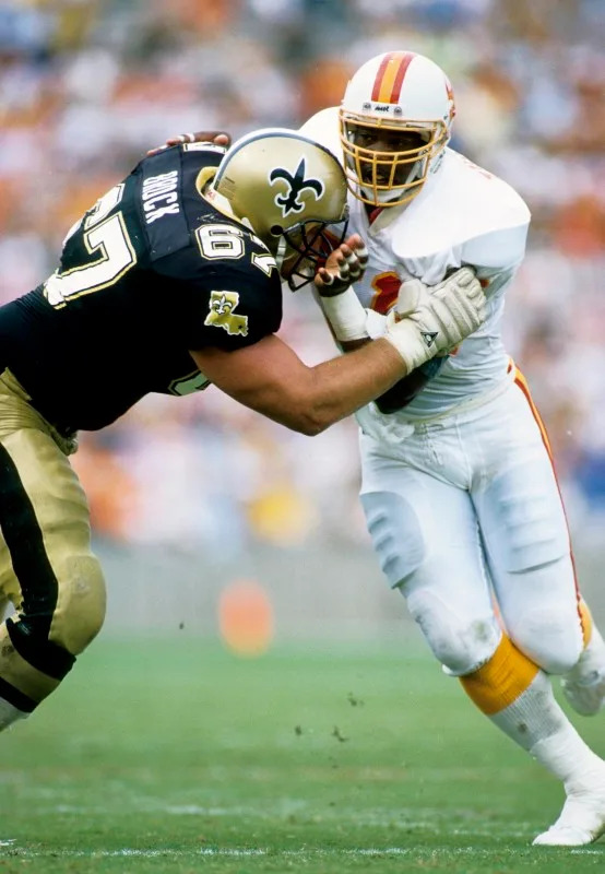 Sep 24, 1989; New Orleans Saints guard Stan Brock (67) blocks Tampa Bay Buccaneers linebacker Broderick Thomas (51). FILE PHOTO/USA TODAY Sports Archive Mandatory Credit: Imagn Images