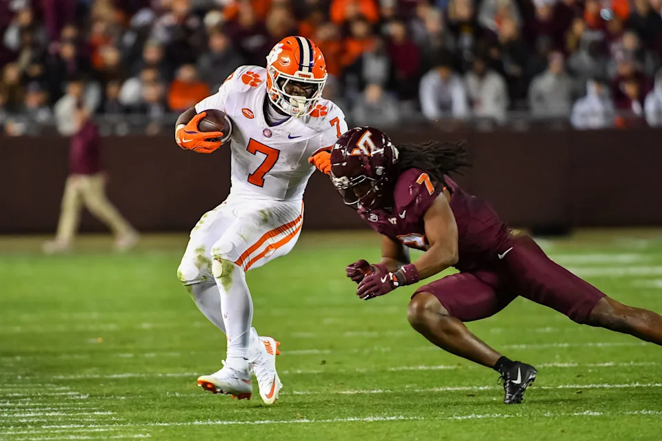 Nov 9, 2024; Blacksburg, Virginia, USA; Virginia Tech Hokies linebacker Keonta Jenkins (7) dives to tackle Clemson Tigers running back Phil Mafah (7) during the fourth quarter at Lane Stadium. Mandatory Credit: Brian Bishop-Imagn Images