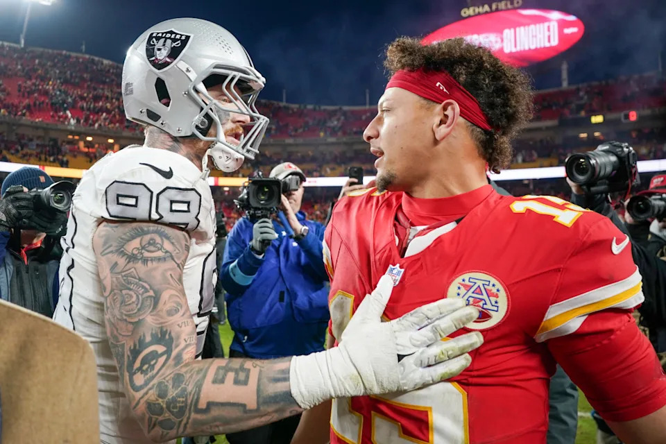 Kansas City Chiefs quarterback Patrick Mahomes (15) greets Las Vegas Raiders defensive end Maxx Crosby (98).Denny Medley-Imagn Images