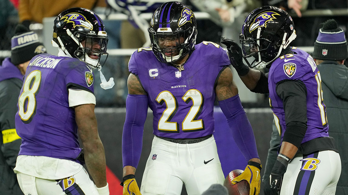 Baltimore Ravens running back Derrick Henry (22) celebrates with wide receiver Nelson Agholor (15) and quarterback Lamar Jackson (8) after scoring a touchdown against the Pittsburgh Steelers in the third quarter in an AFC wild card game at M&T Bank Stadium.