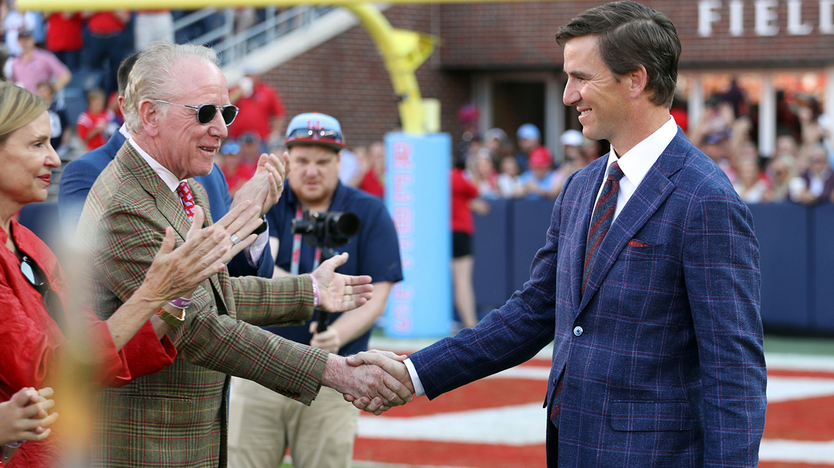 Archie Manning and Eli Manning, who met up with Jaxson Dart of the New York Giants at Fanatics Fest, at Ole Miss for his football jersey retirement by the Rebels.
