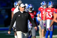 FILE - In this Nov. 19, 2016, file photo, Kansas coach David Beaty stands near players...