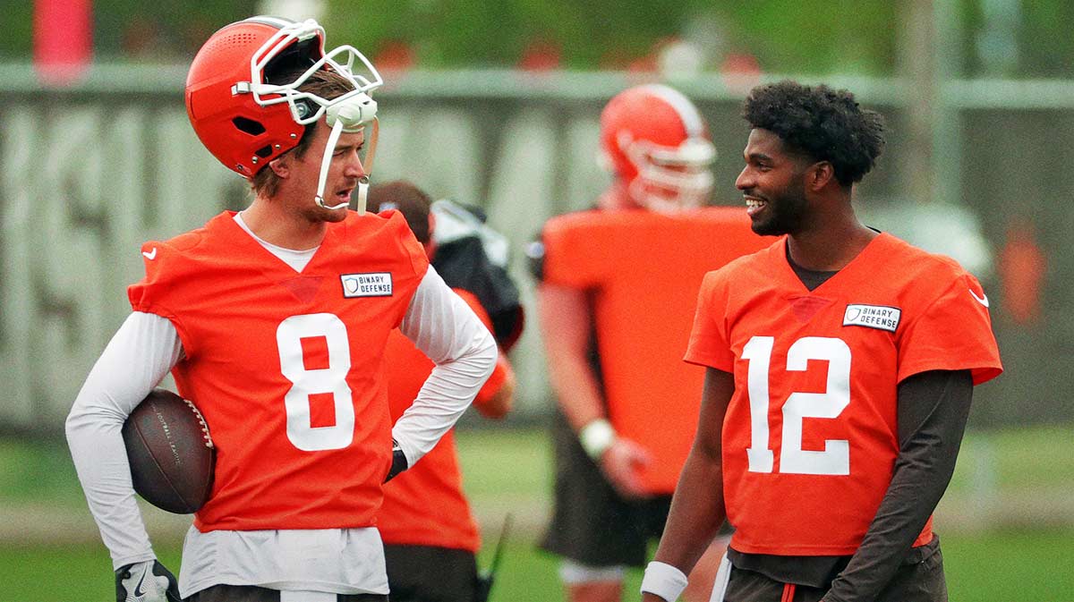 Cleveland Browns quarterback Kenny Pickett, left, chats with quarterback Shedeur Sanders (12) during an NFL practice at the Cleveland Browns training facility on Wednesday, May 28, 2025, in Berea, Ohio.