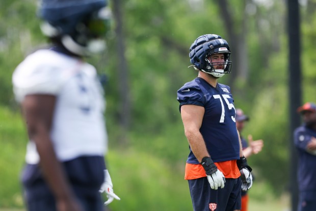 Bears offensive tackle Ozzy Trapilo stands on the field during practice at Halas Hall on June 10, 2025. (Eileen T. Meslar/Chicago Tribune)