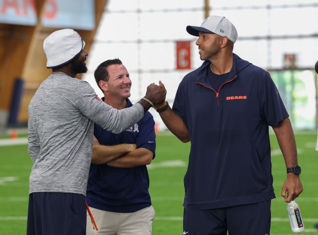 Devin Hester, Ian Rapoport, and Ian Cunningham, talk during the...