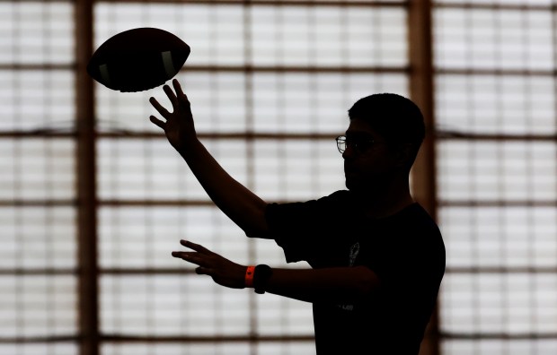 Antonio Vigil of the U.S. Marine Corps throws a pass...